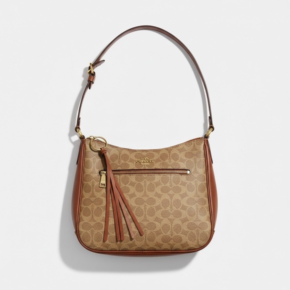 Coach Handbags - Coach Tan Signature Canvas crossbody with Brown Leather Trim